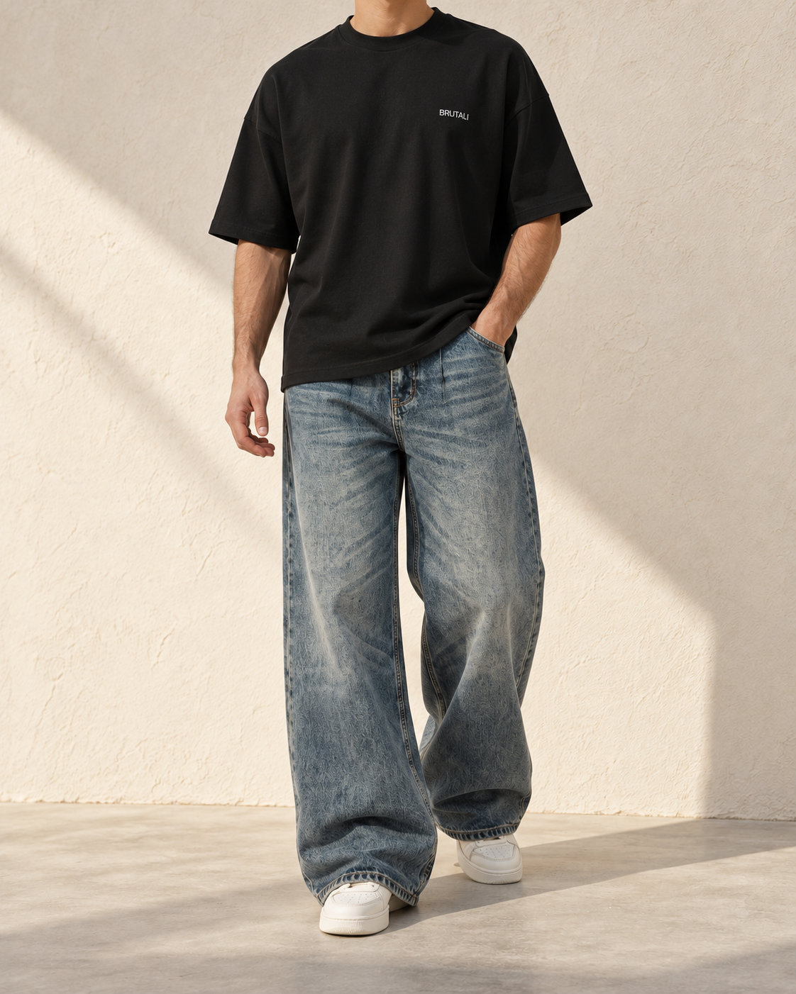 BRUTALI black relaxed T-shirt styled with wide-leg jeans
